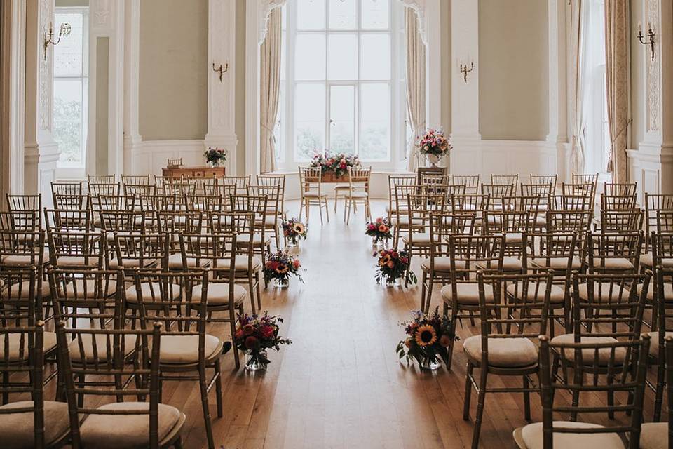 Frensham Hall ballroom wedding setup, elegant ceremony, floral decor