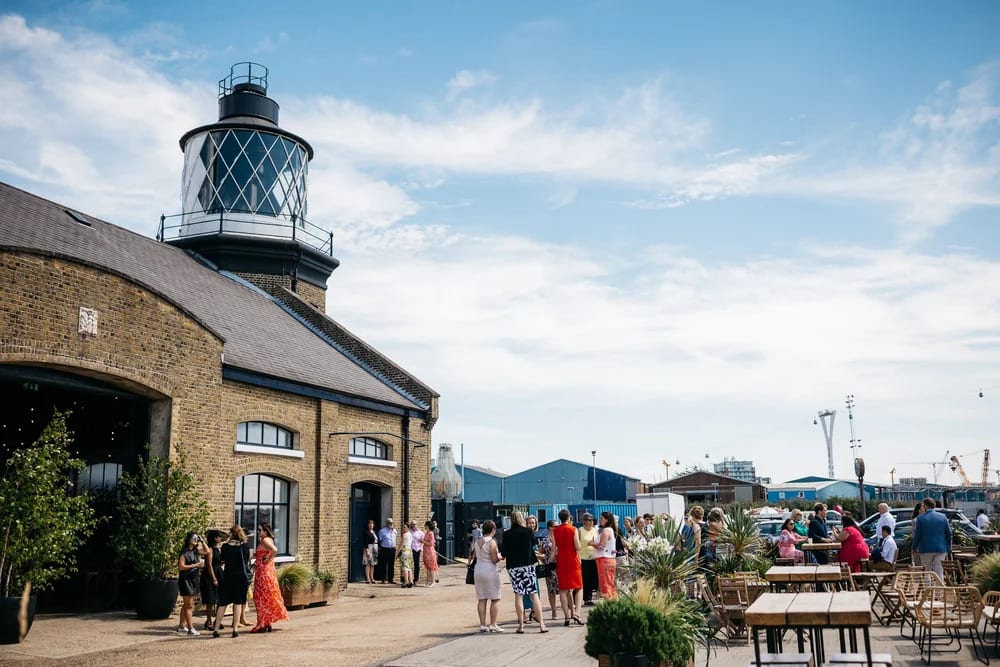 Coastal venue with lighthouse, open-air reception, corporate event