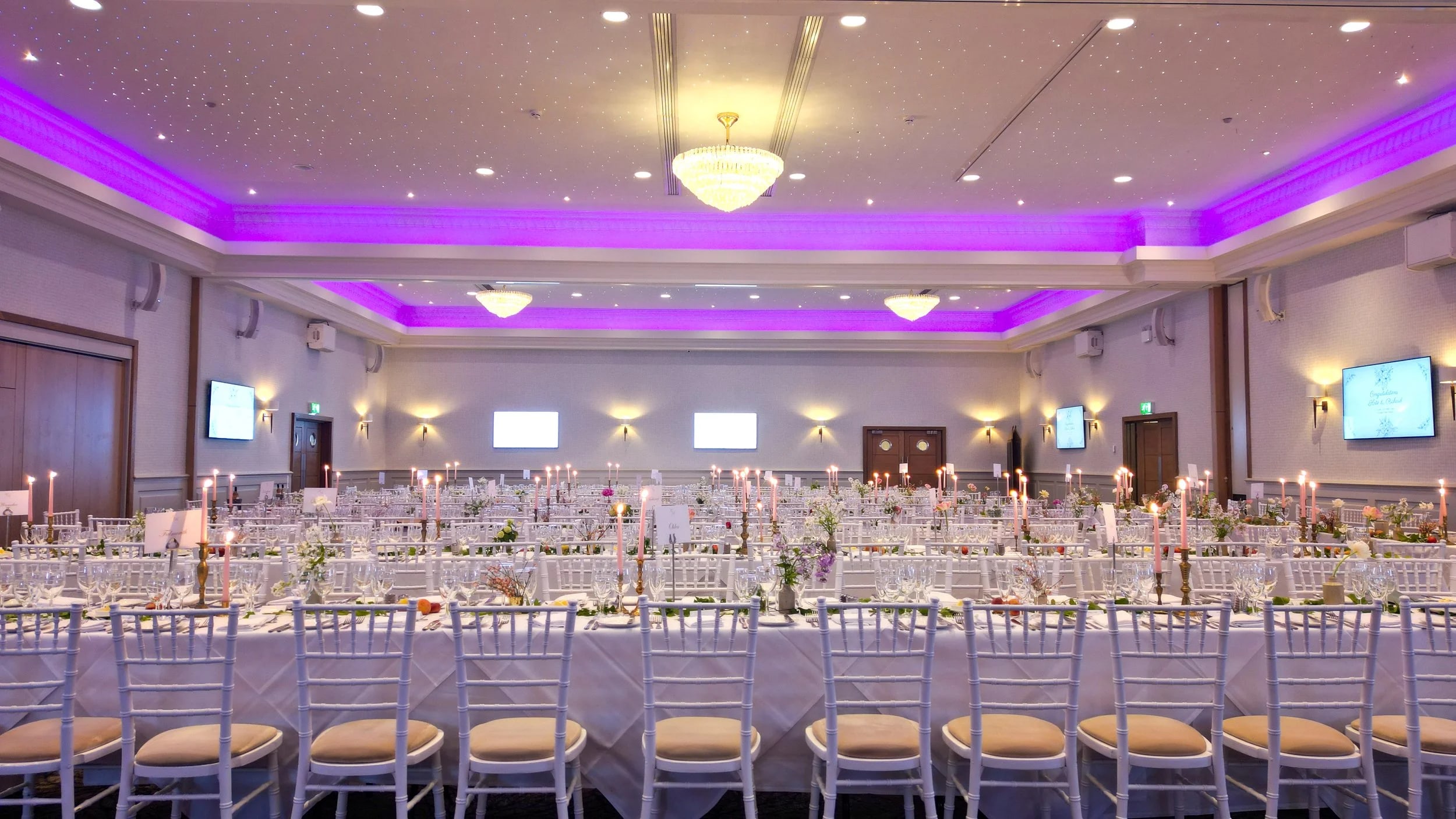 Carden Park Hotel ballroom gala event white chairs