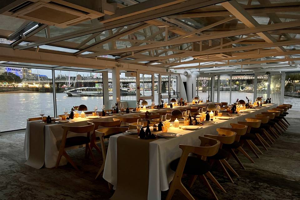 Yacht dining, elegant city views, corporate event, product launch