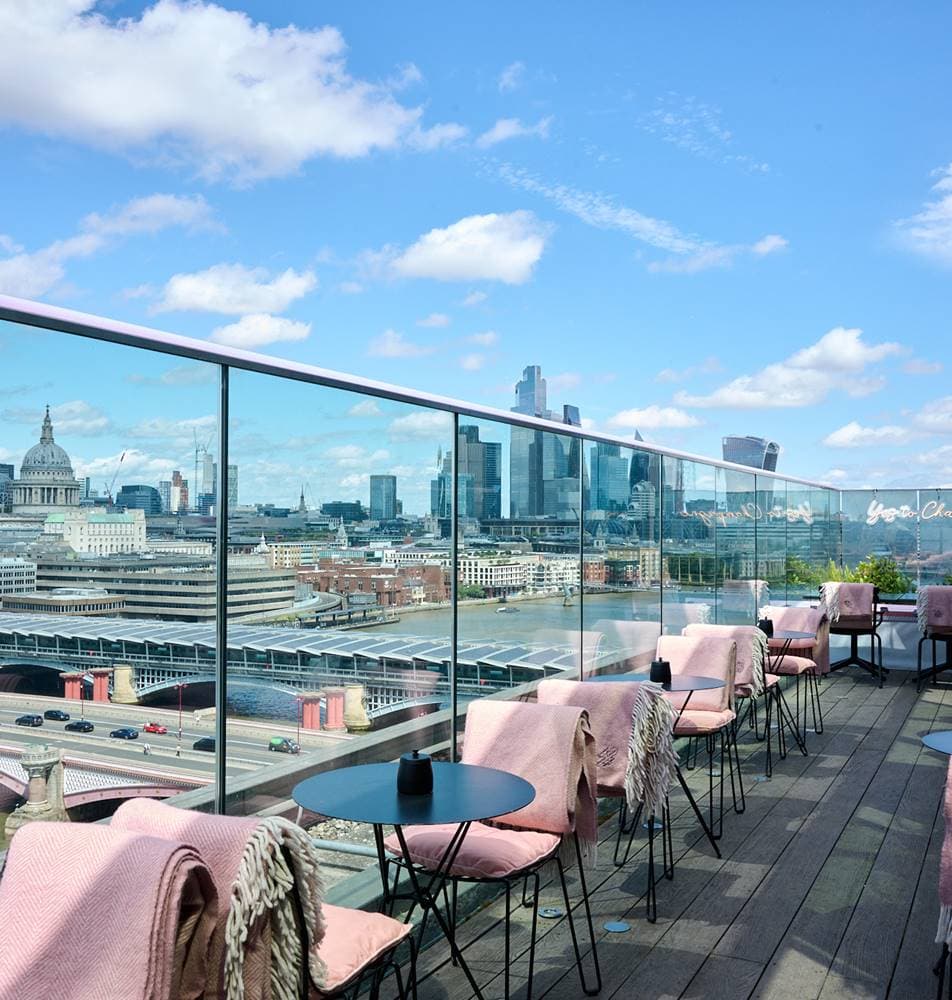 Rooftop bar, city skyline, corporate event, networking