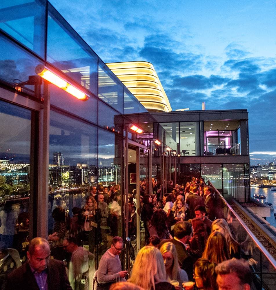 Rooftop bar city views corporate event networking mixer