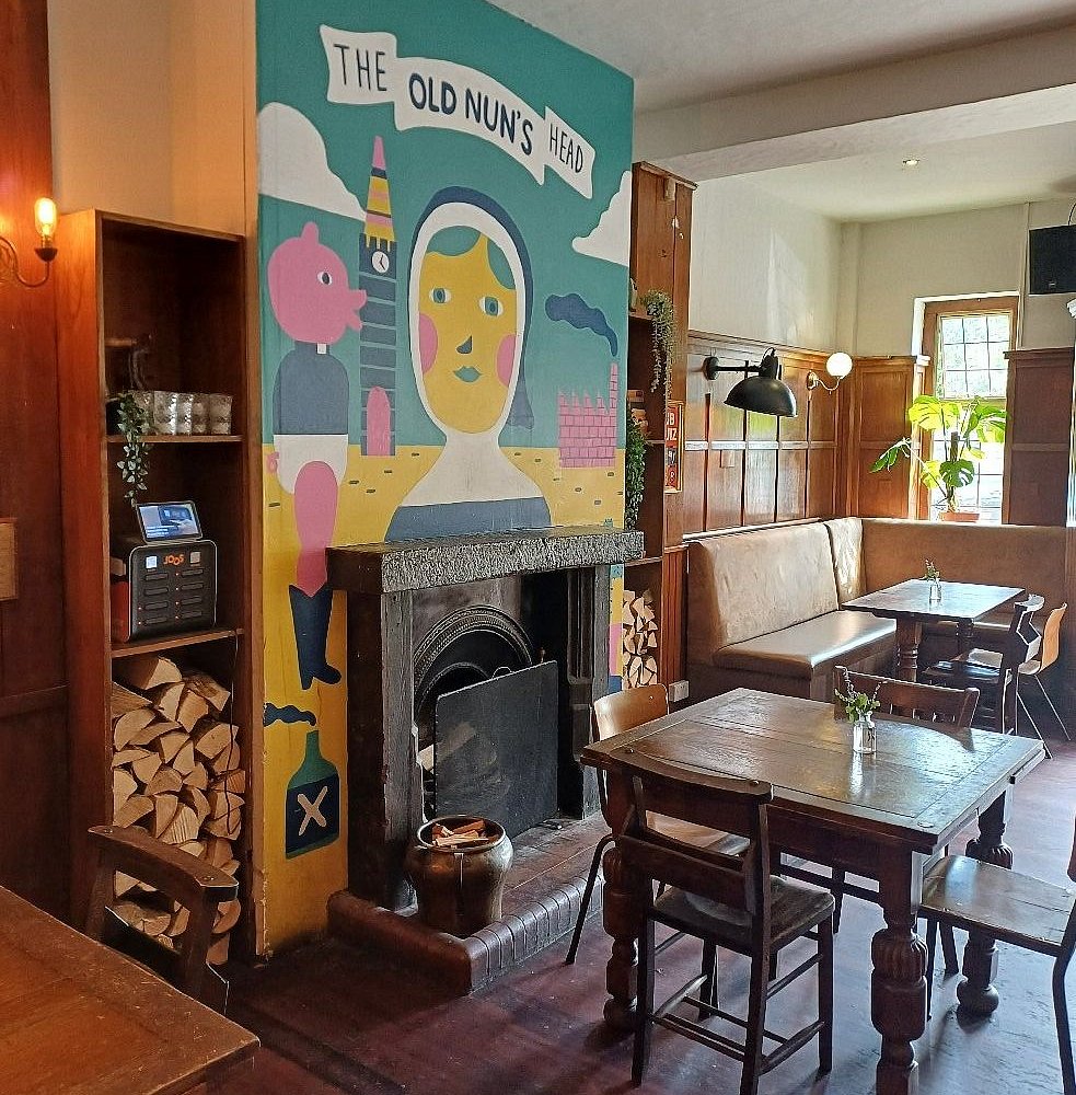 The Nun Above mural, fireplace, intimate venue, pub event