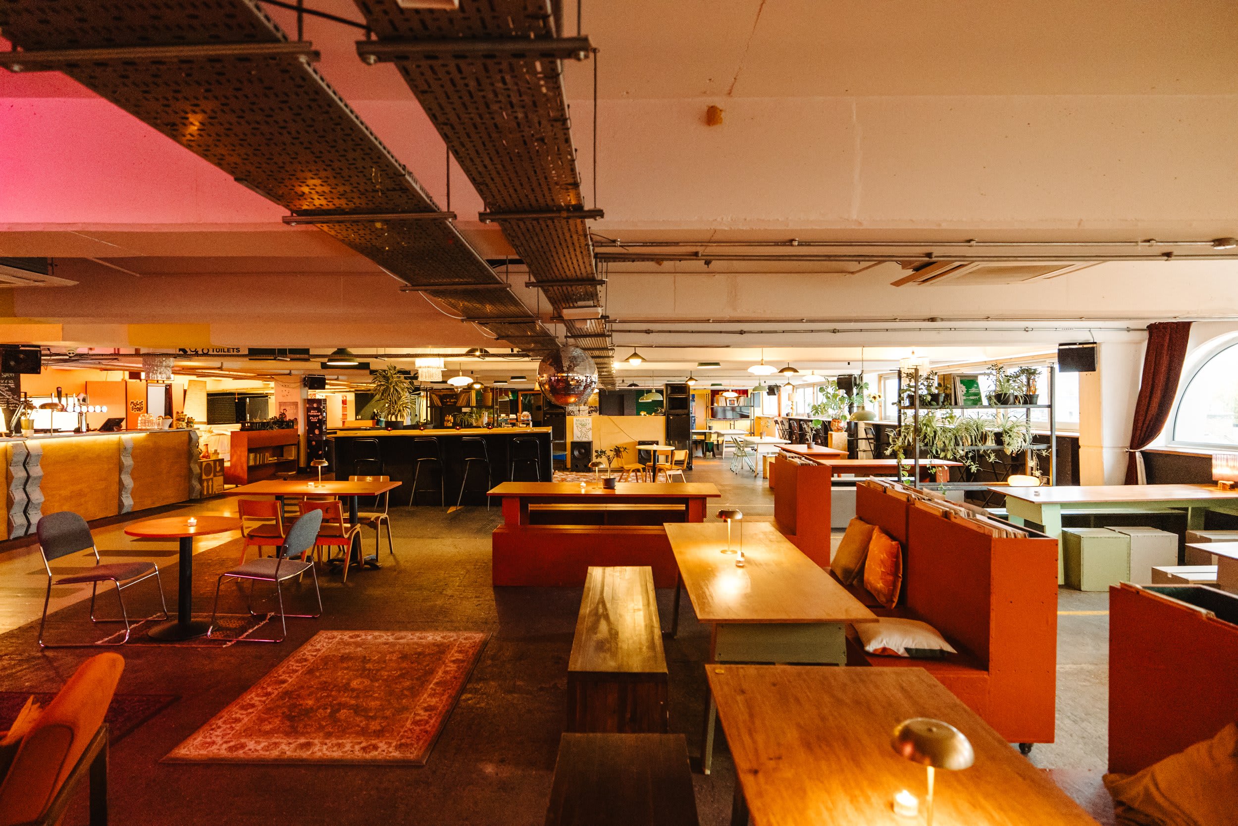 Industrial chic venue: Bar, seating, event space