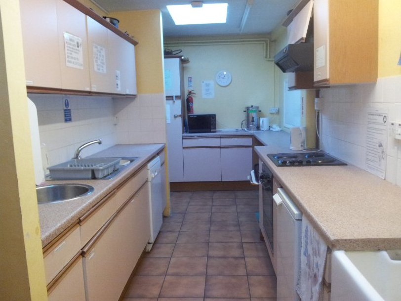 Outdated kitchenette in The Arbor Centre Main Hall for event catering renovation.