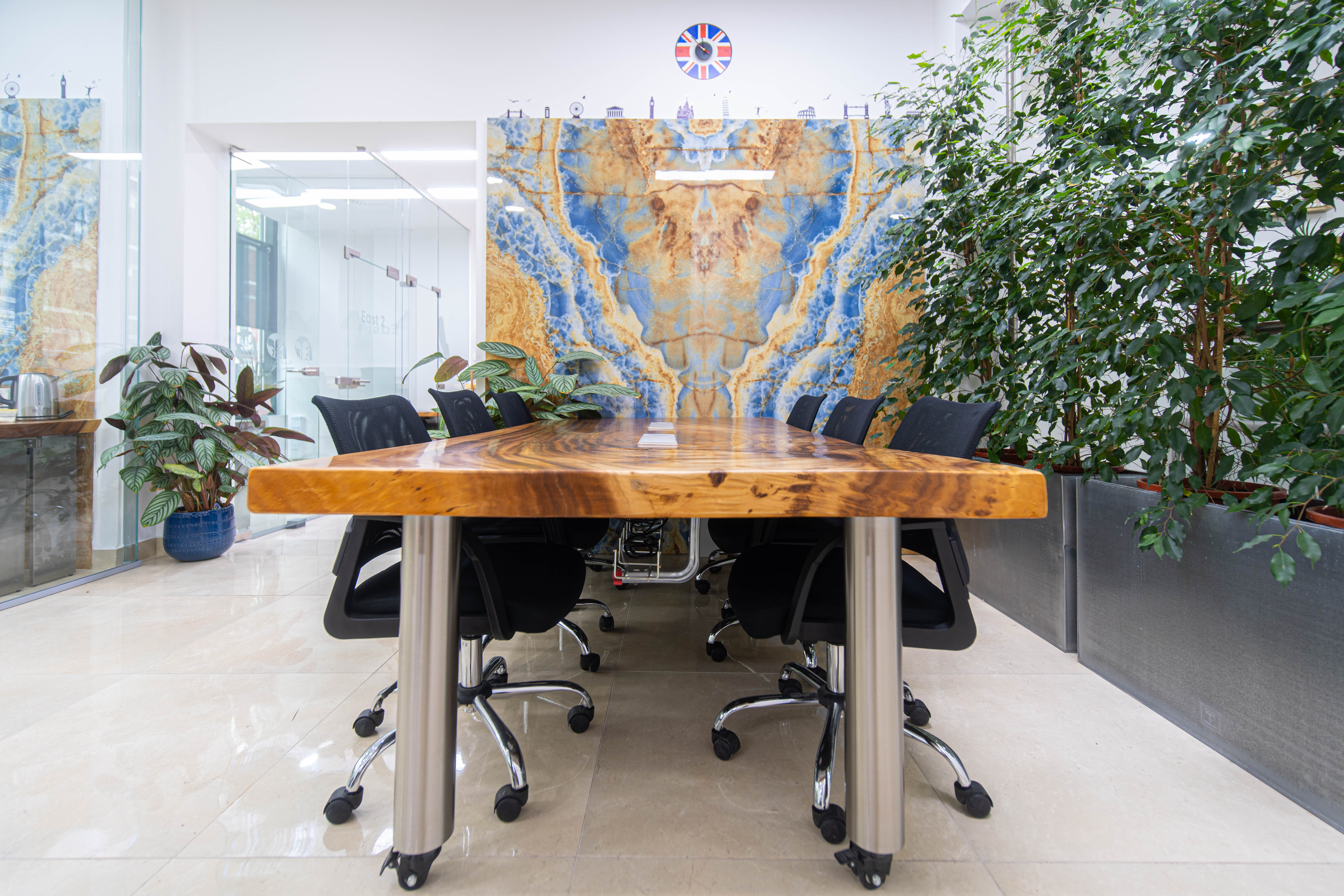 Camden high-end boardroom, live-edge table, onyx backdrop, networking event