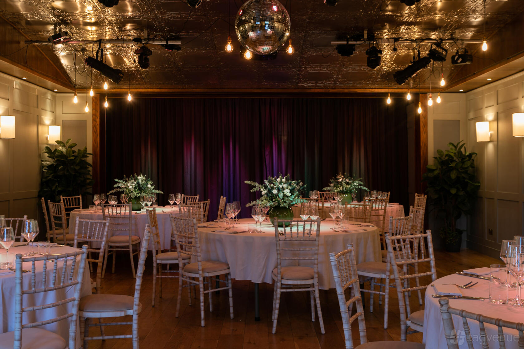 Round table event space, disco ball, corporate dinner, wedding