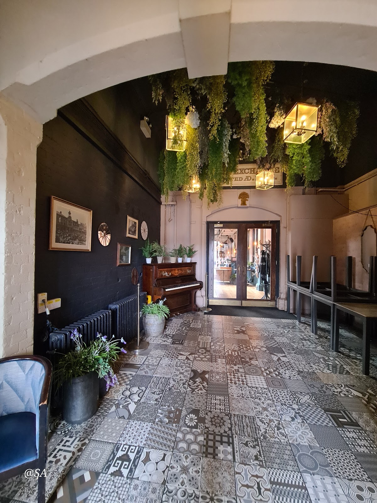 Glasshouse venue, green decor, live music event