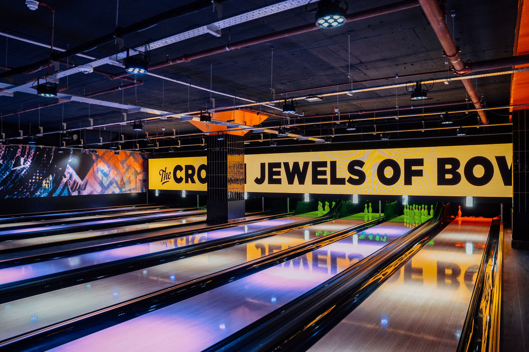 The Strike Zone at King Pins Edinburgh: Neon-lit venue for corporate team-building events.