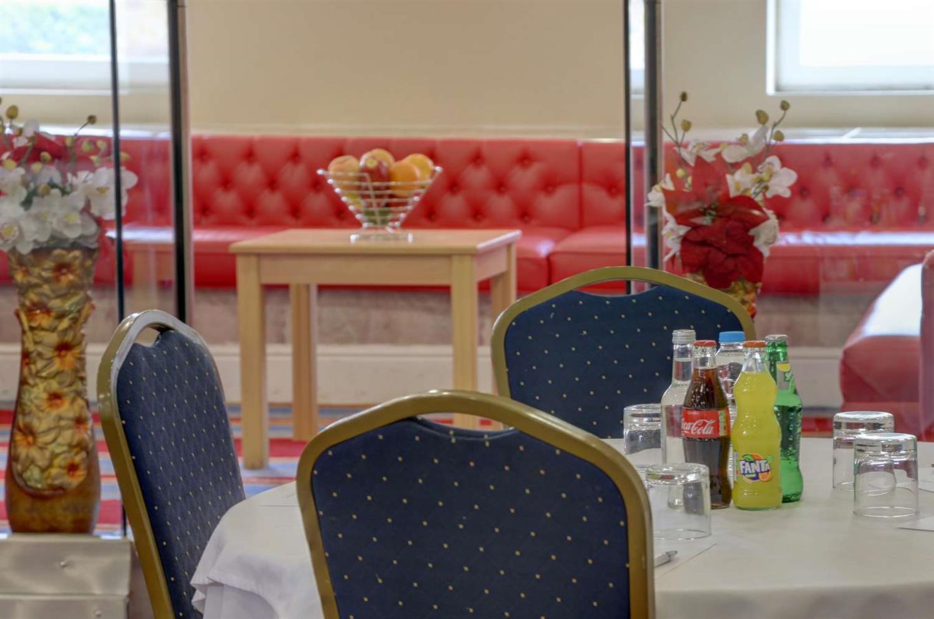 London hotel meeting, red seating, business conference venue