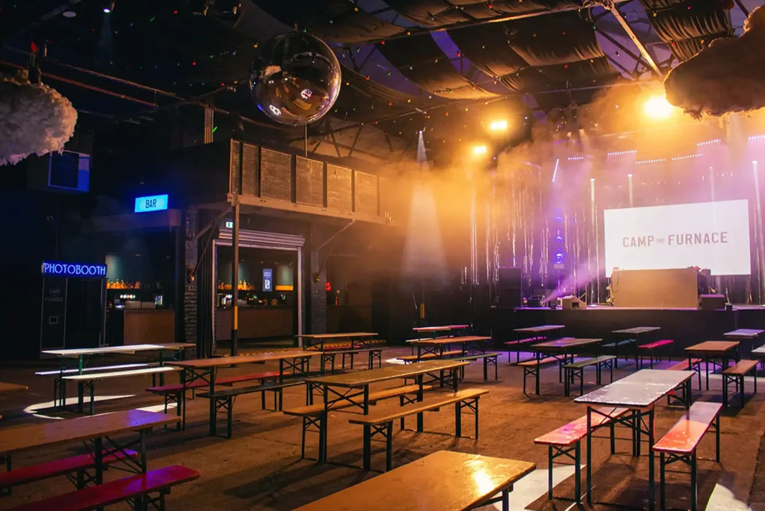 Industrial event venue stage disco ball concert launch