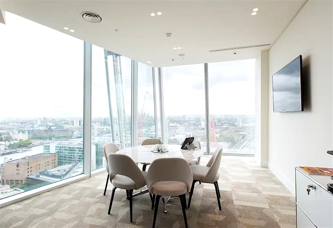 London Bridge executive meeting room, skyline view, board meeting, client discussion.