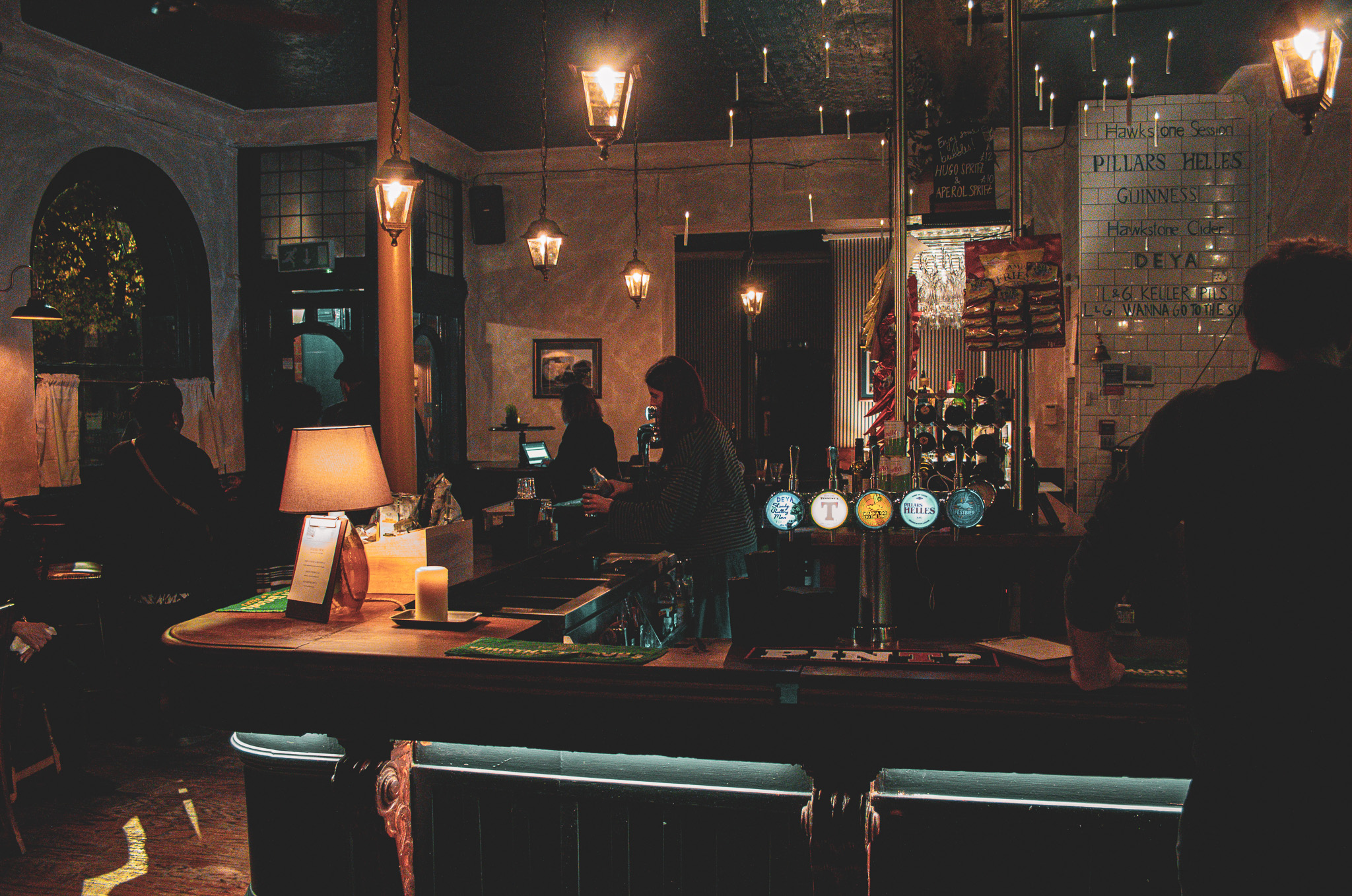 Networking reception at The Lock & Lantern roof terrace featuring atmospheric bar lighting.