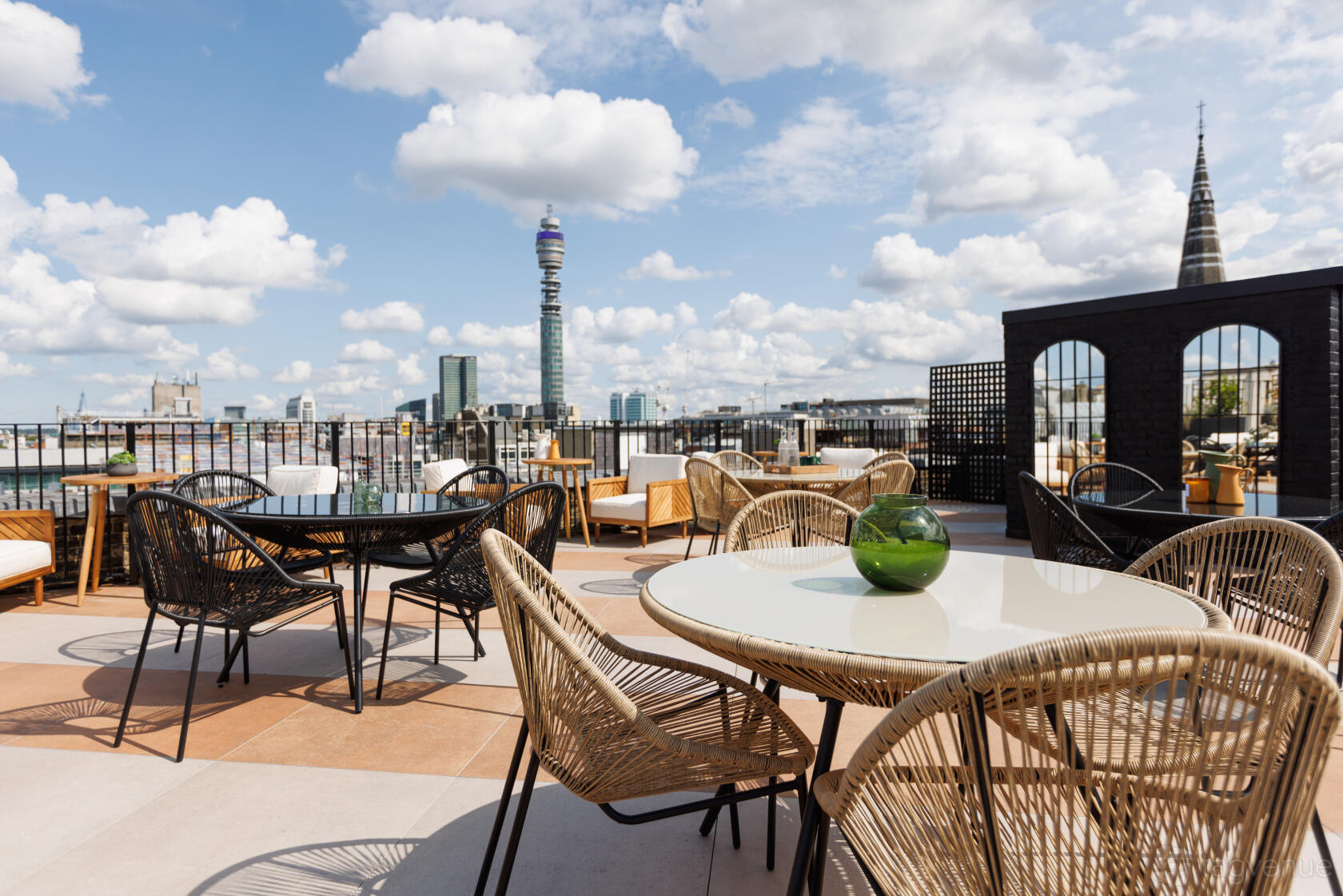 Rooftop event venue, city views, cocktail reception, networking.