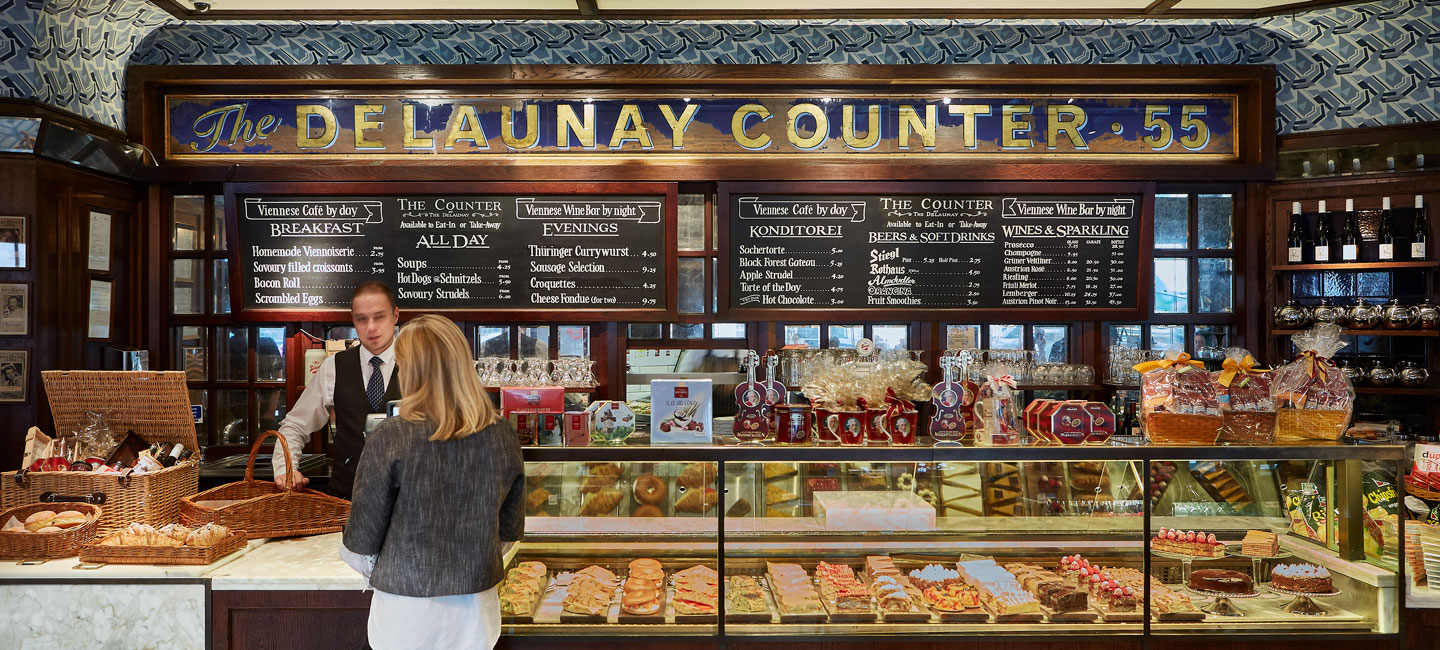 Upscale launch counter, gold trim, VIP gifting suite