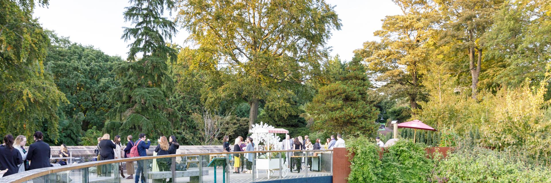 Outdoor networking reception at Royal Botanic Garden Edinburgh, lush garden corporate event venue.