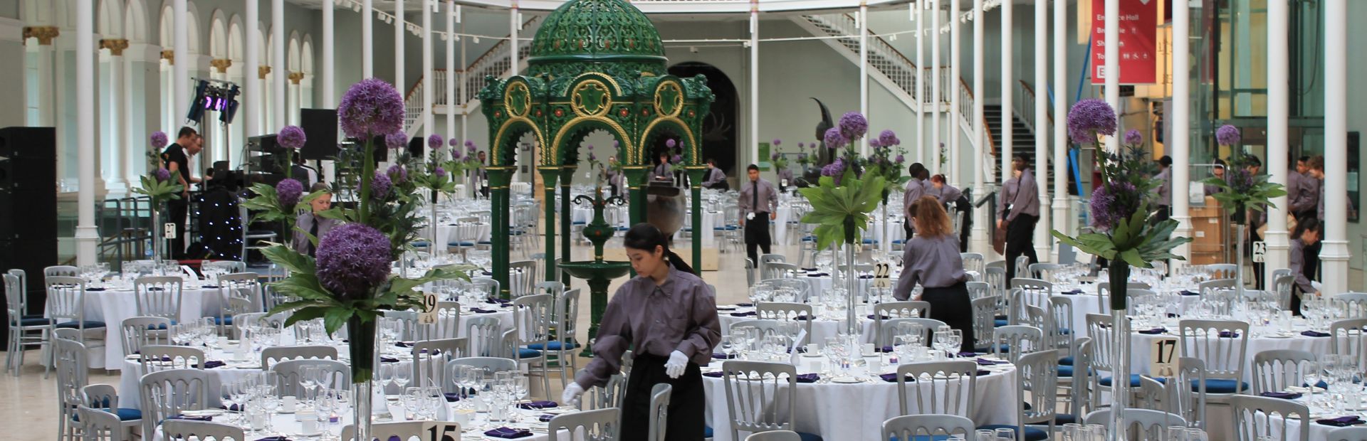 Elegant ballroom gala setup at Edinburgh Zoo with floral centerpieces for luxury event catering.