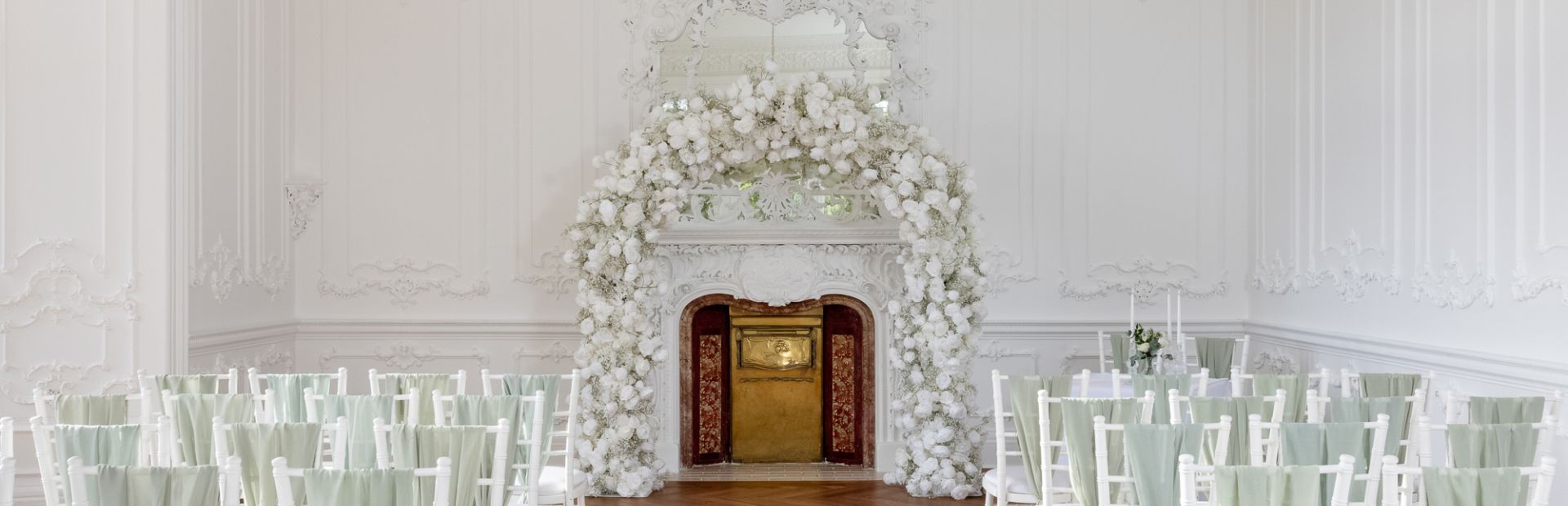 Floral arch ceremony setup at Heritage Portfolio venue for luxury weddings and events.