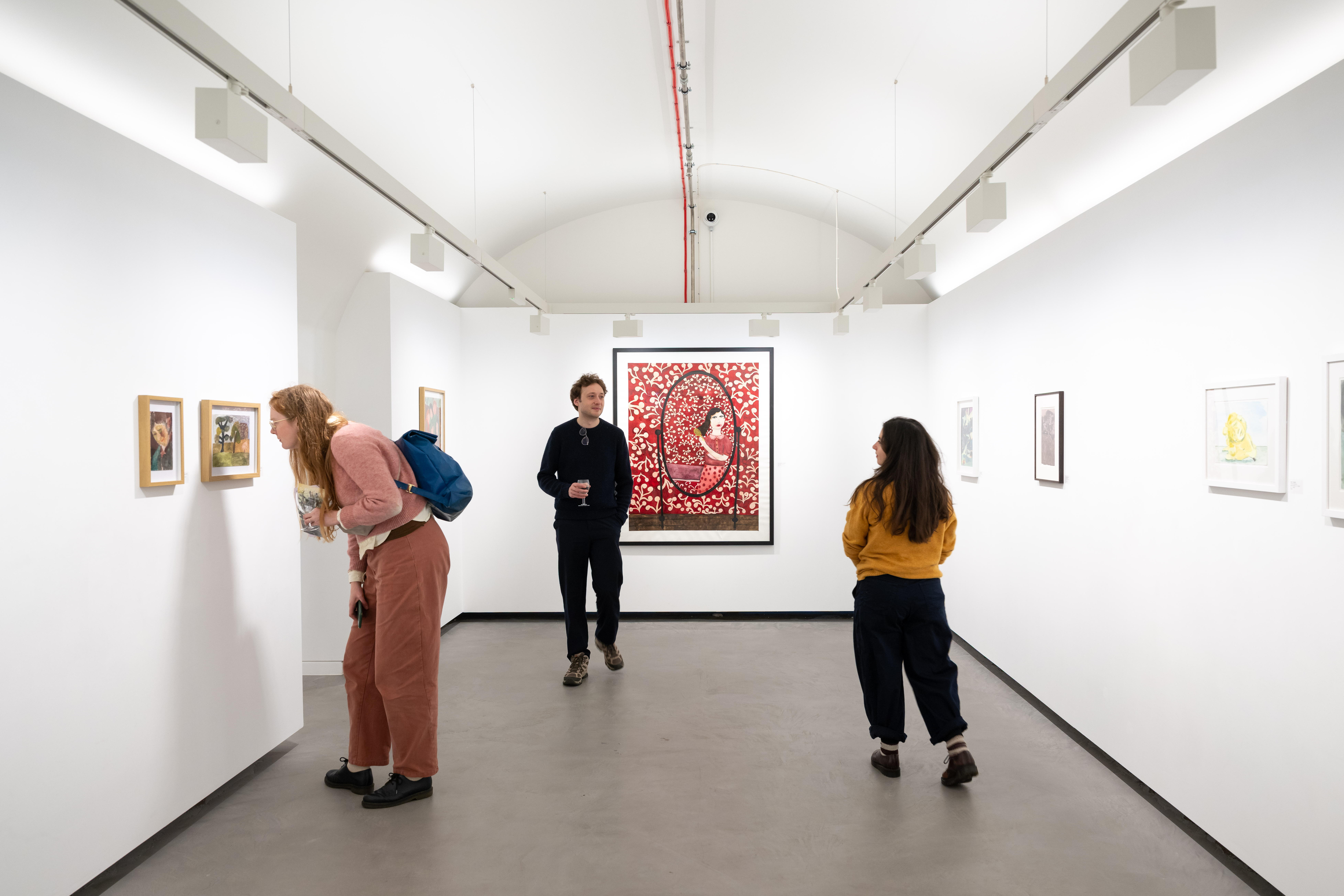 Minimalist art gallery, intimate reception space for VIP networking and exclusive gallery events.