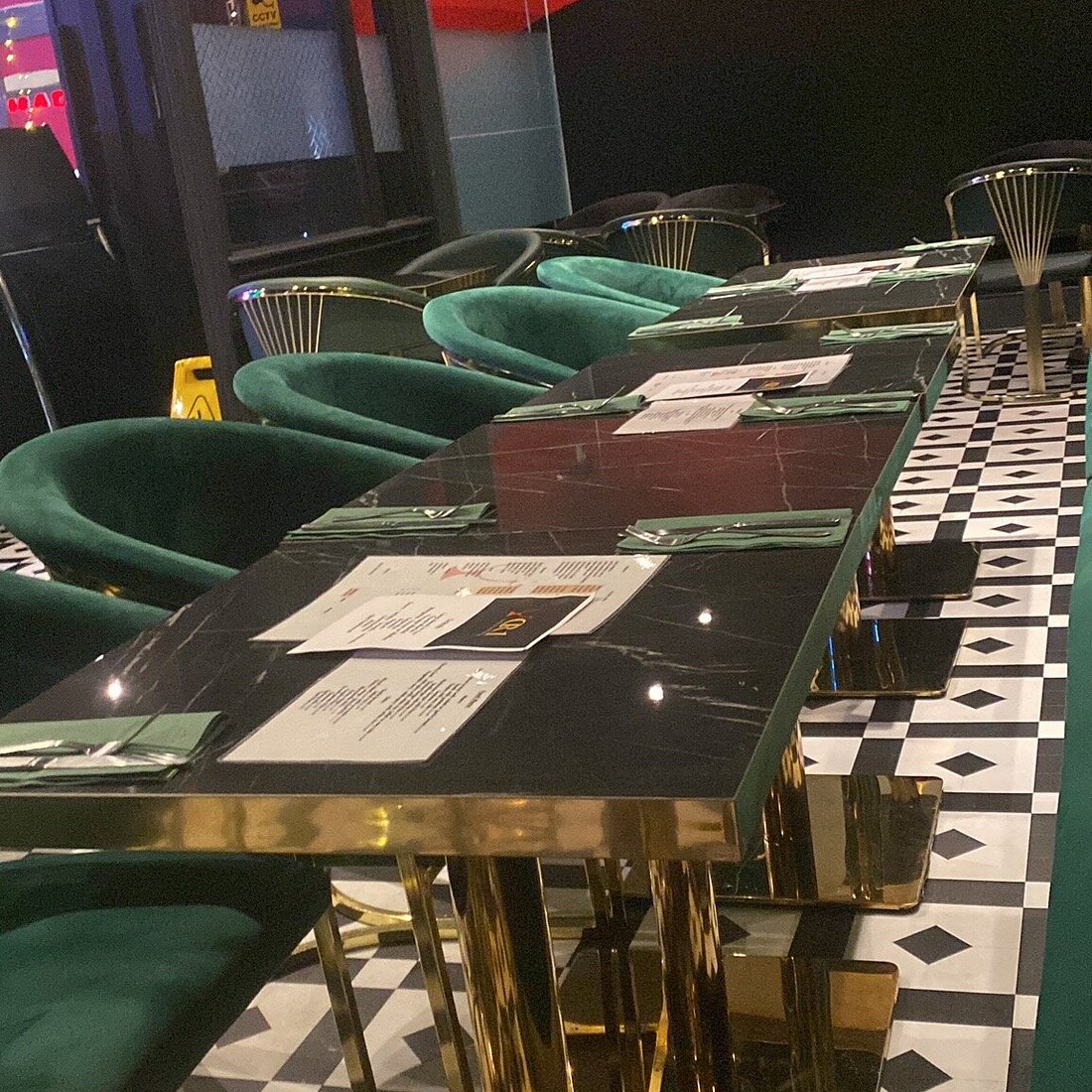 Emerald velvet chairs at The Brasserie, CR1 Bar: upscale corporate dinner and networking venue.