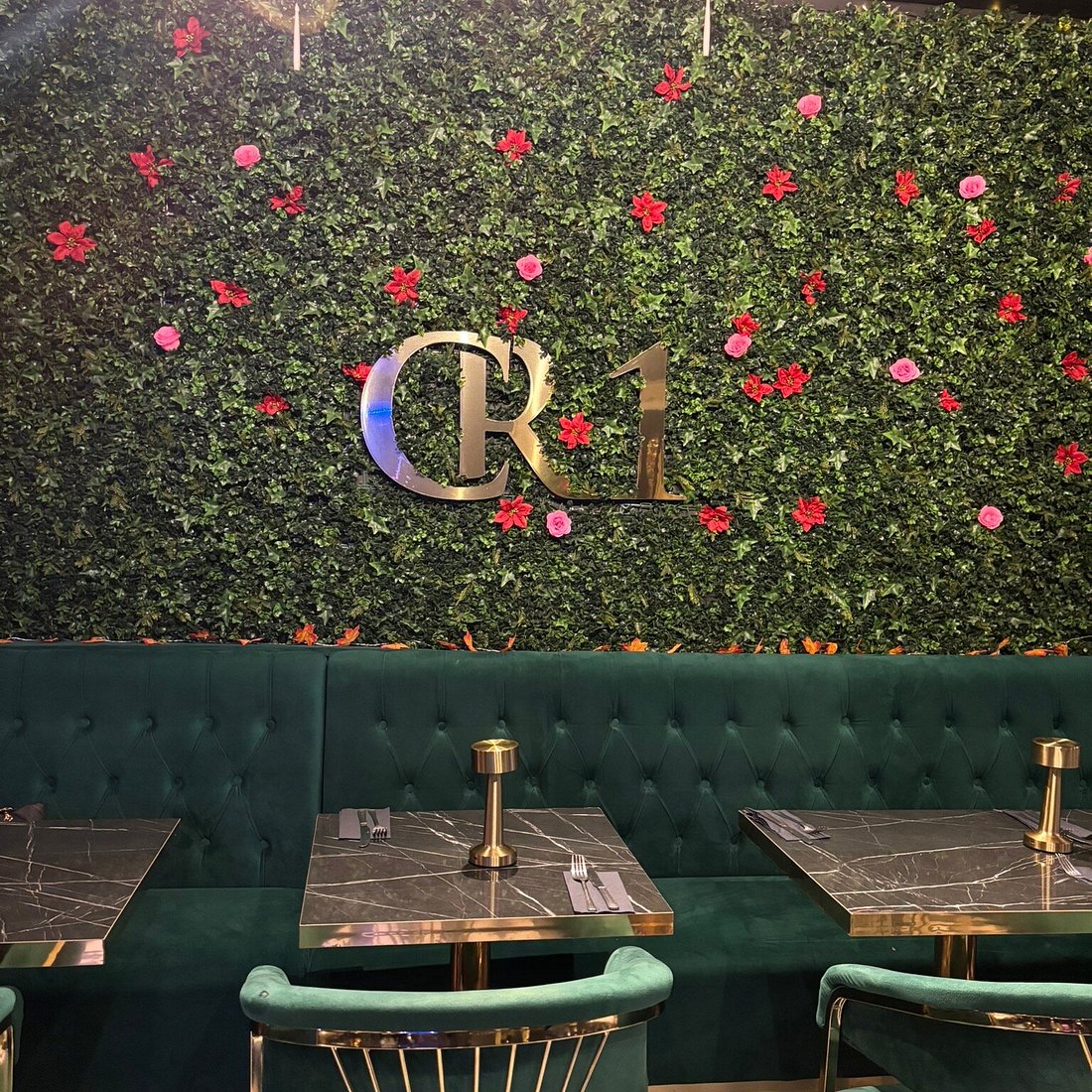 Floral green wall with velvet seating at The Leaf Room, perfect for private event photography.