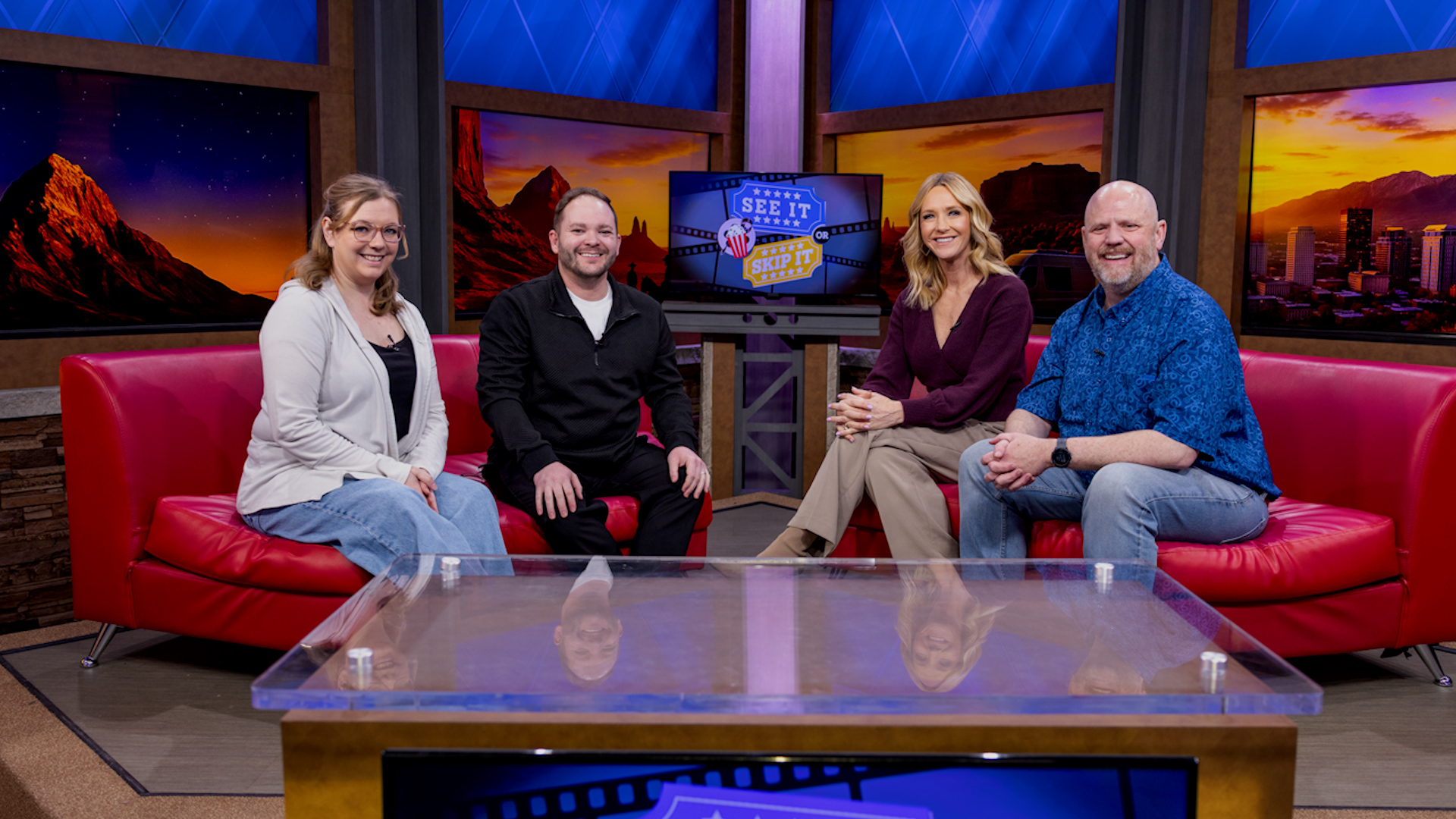Corporate game show studio with red sofa seating for team building and office events.