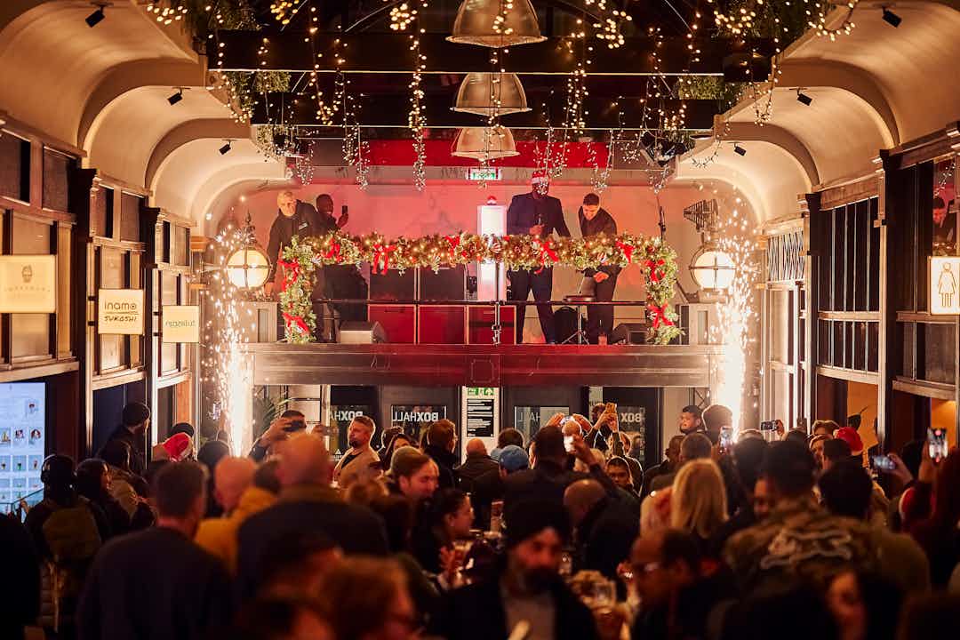 The Snug at BOXHALL City: high-energy holiday event with stage pyrotechnics and immersive lighting.