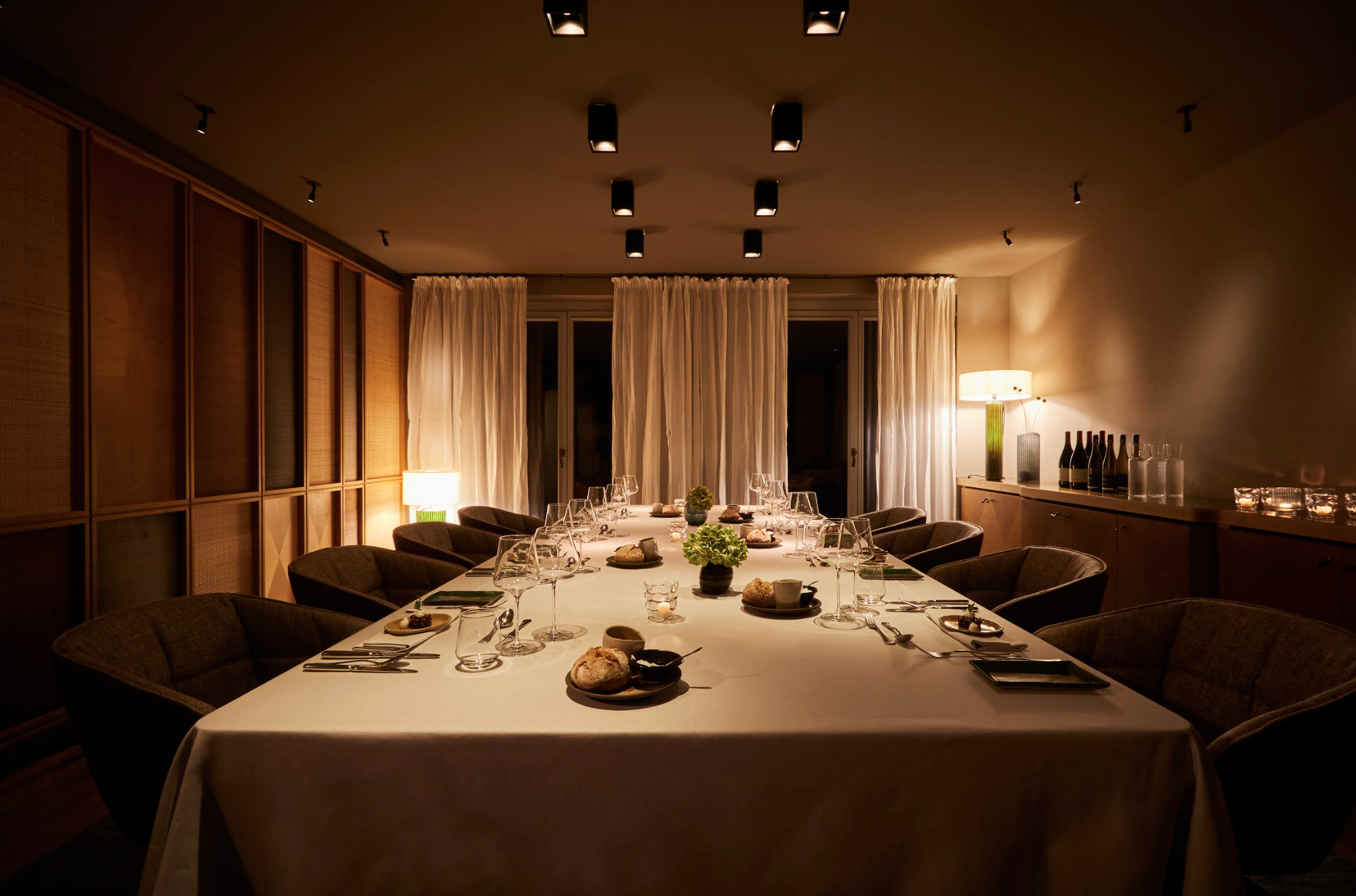 Private boardroom dining at LOUIS Hotel, perfect for exclusive corporate retreats and events.
