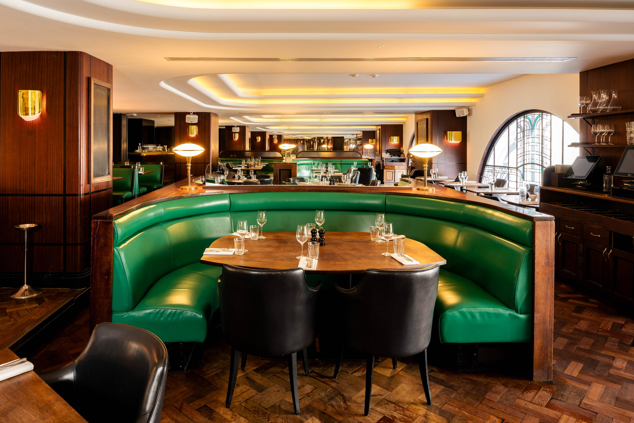 Hawksmoor Air Street bar area with crescent booths for upscale business event networking.