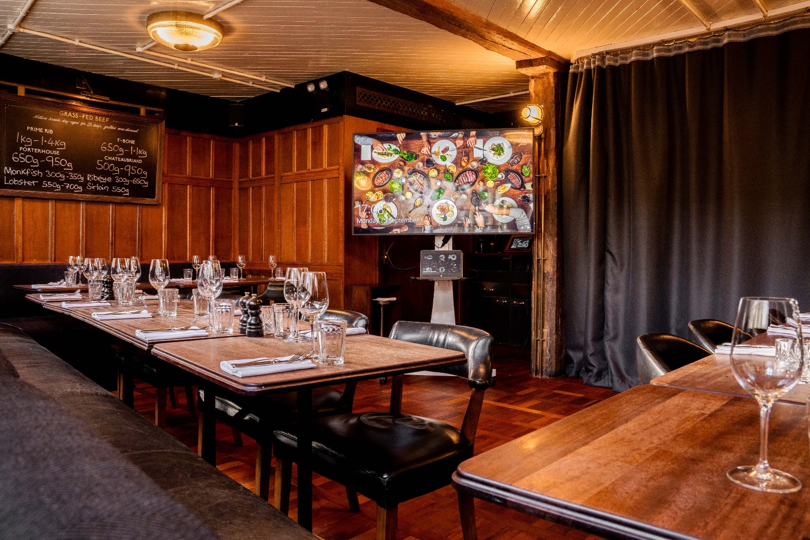 Wood-paneled private dining room at Hawksmoor Borough for corporate events and team building.