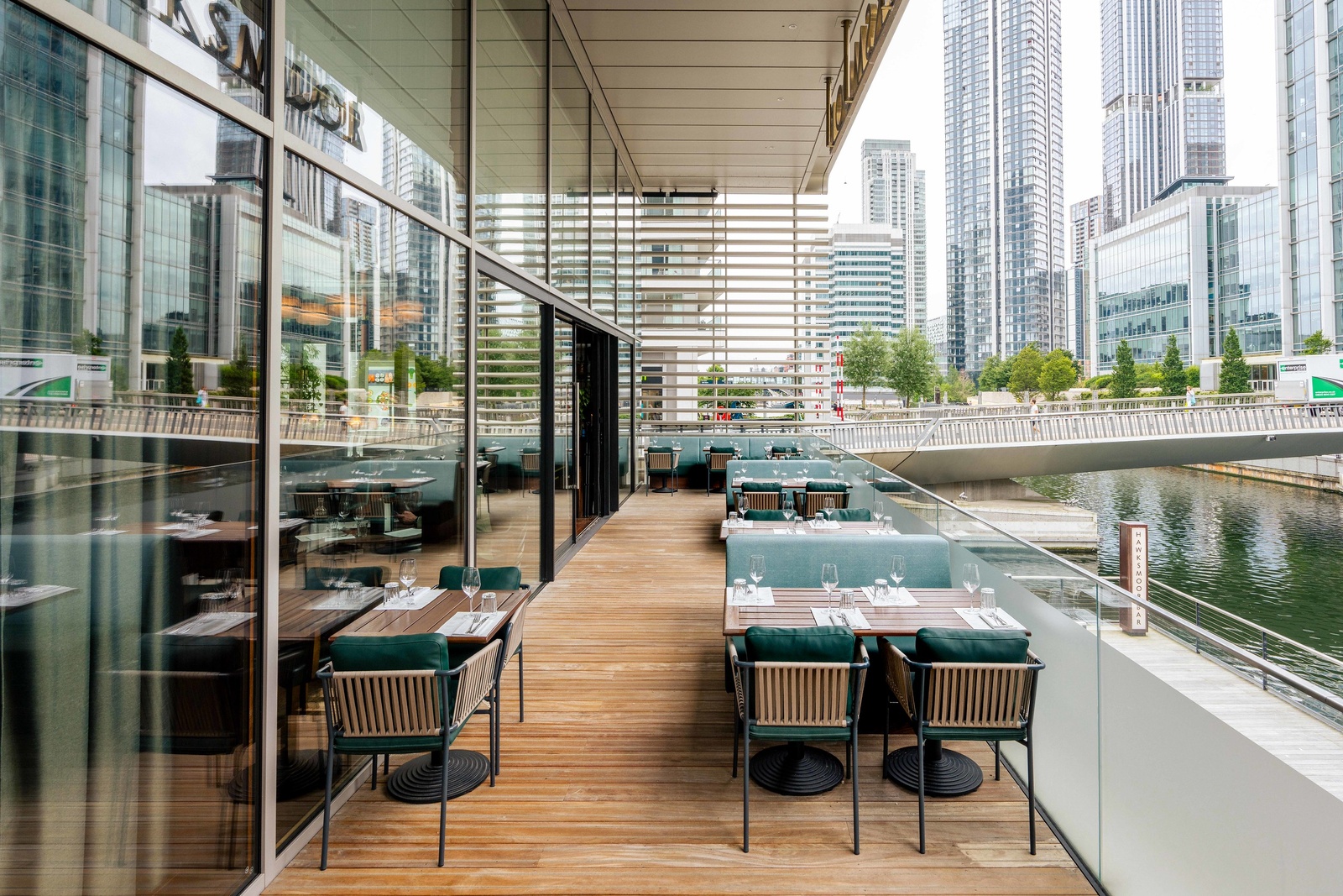 Queenie Watts canal-side terrace at Wood Wharf for corporate networking and dinner events.