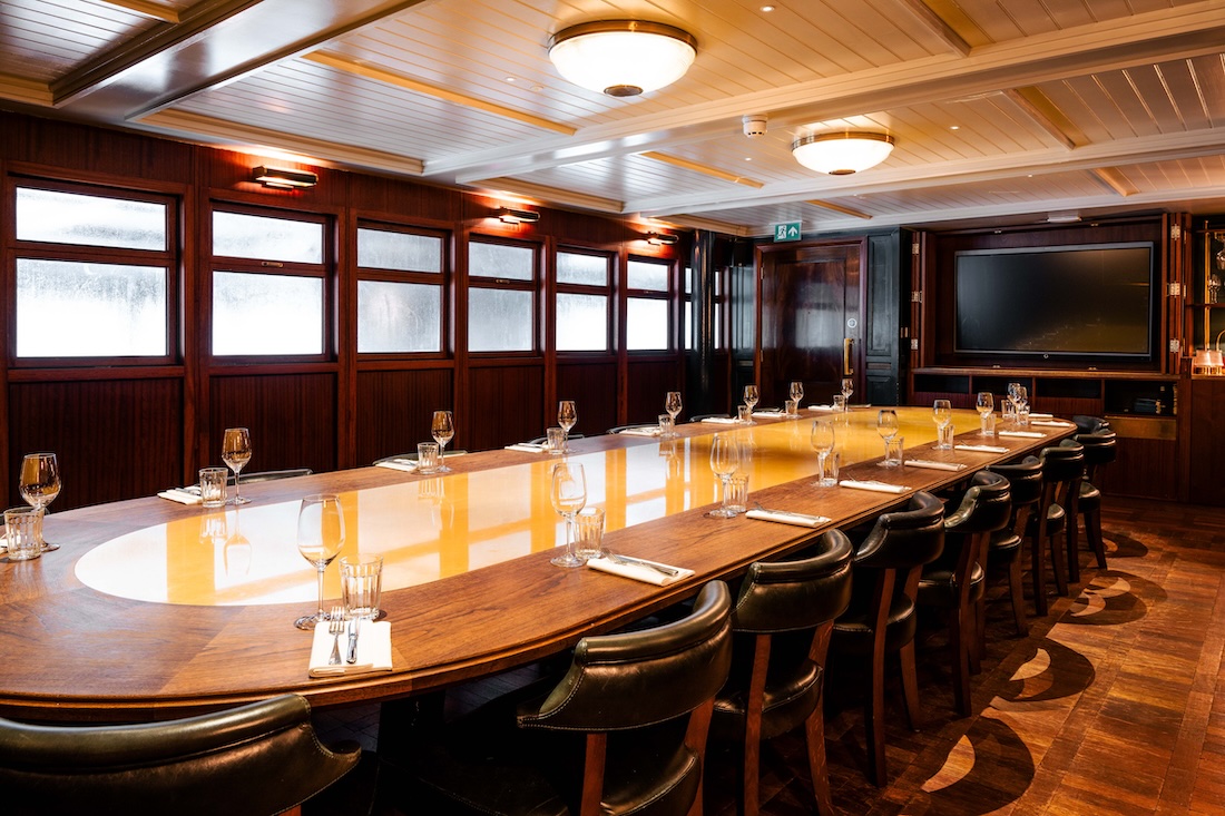 Queenie Watts boardroom setup for executive dinner or corporate off-site planning at Wood Wharf.