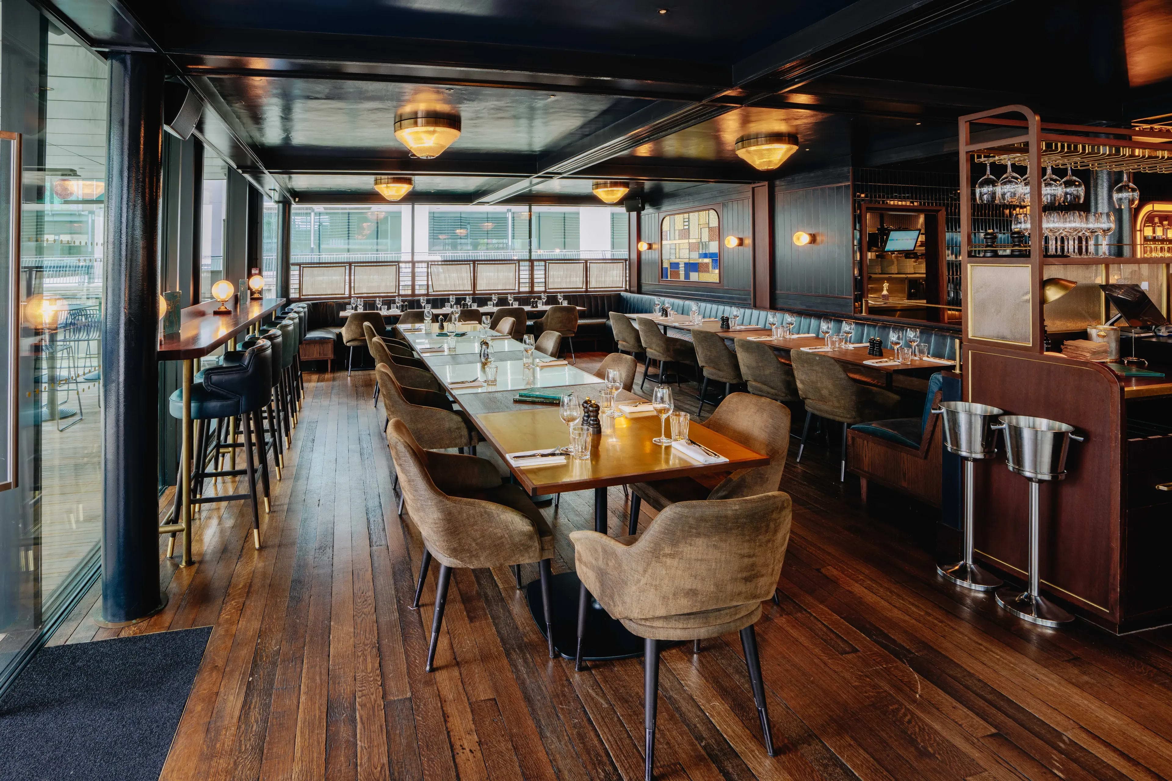 Waterview at Hawksmoor: Elegant long-table setup for corporate dinners and networking events.