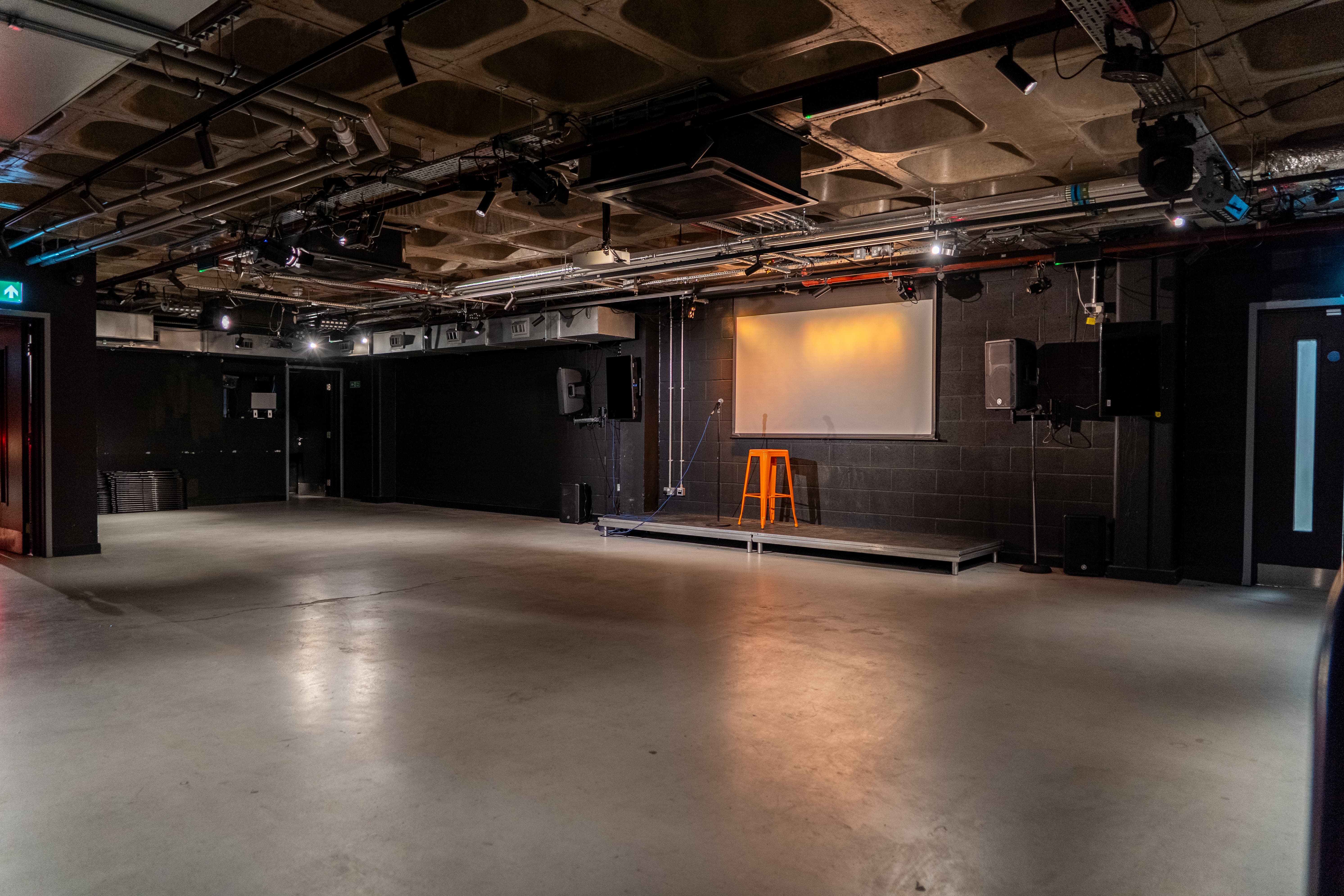 Big Belly Room industrial black box venue for comedy club events and corporate workshops.