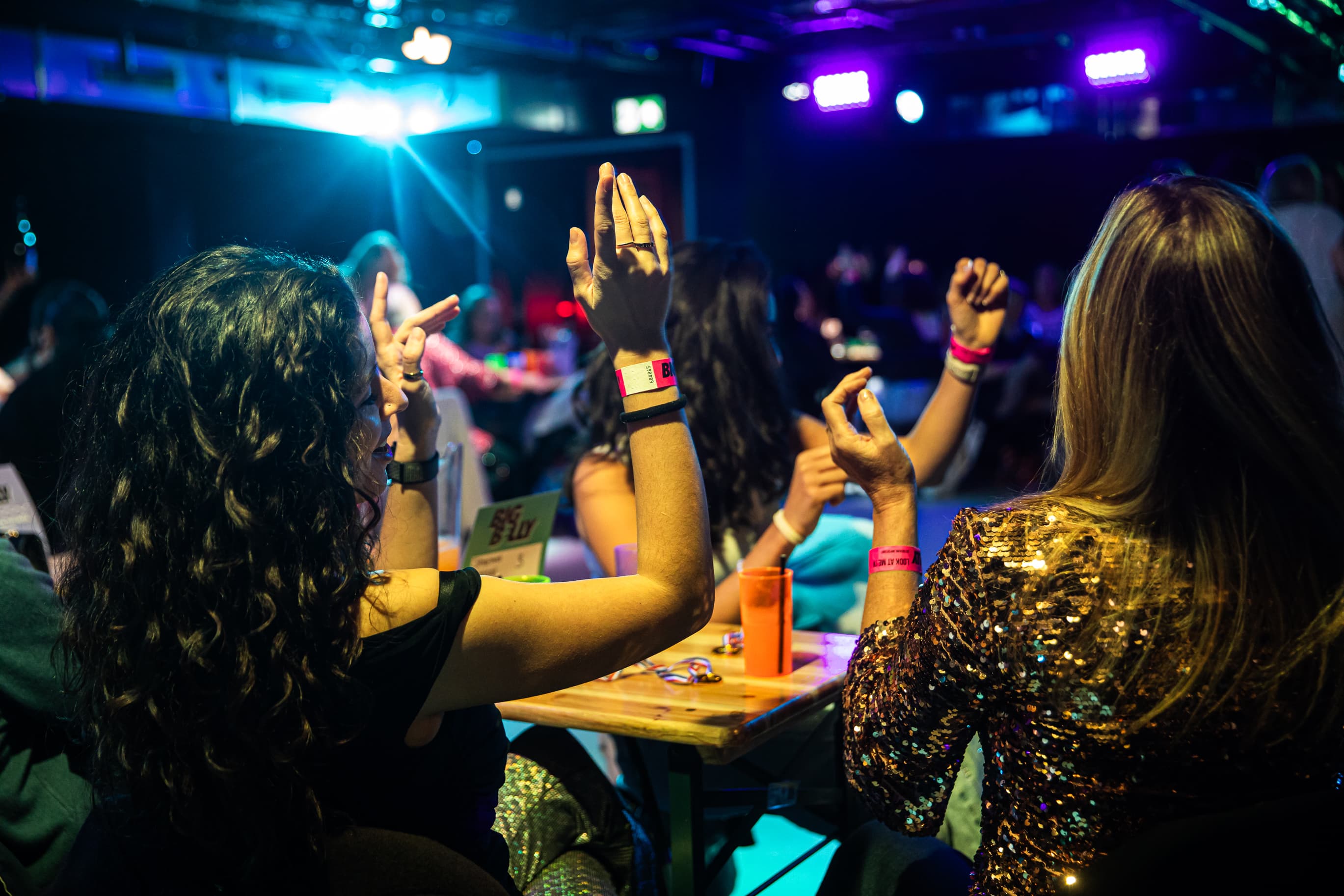 Big Belly Comedy Club event with vibrant stage lighting, ideal for live stand-up comedy shows.