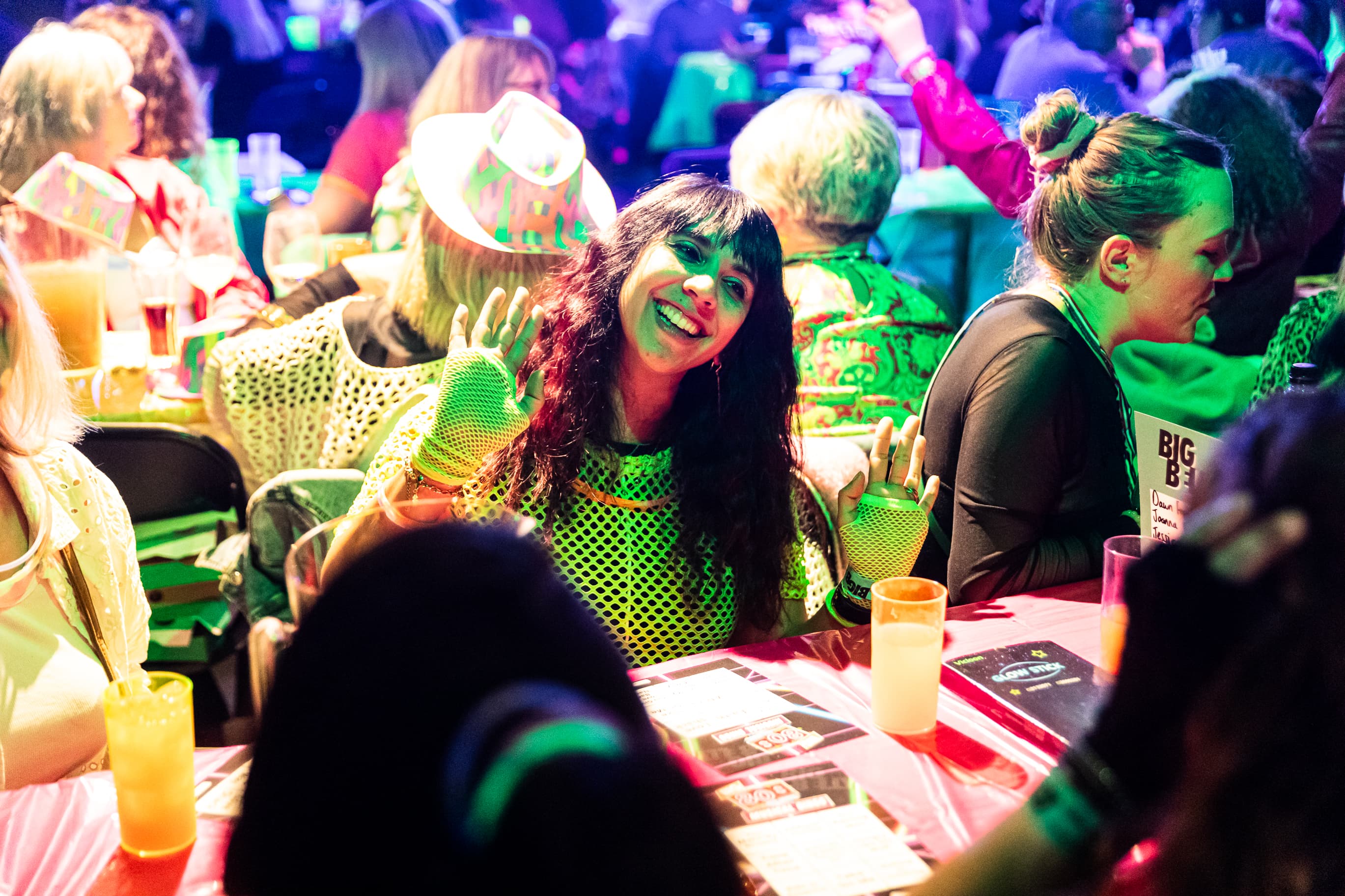 Big Belly Room comedy club networking event with vibrant lighting and branded gala decor.