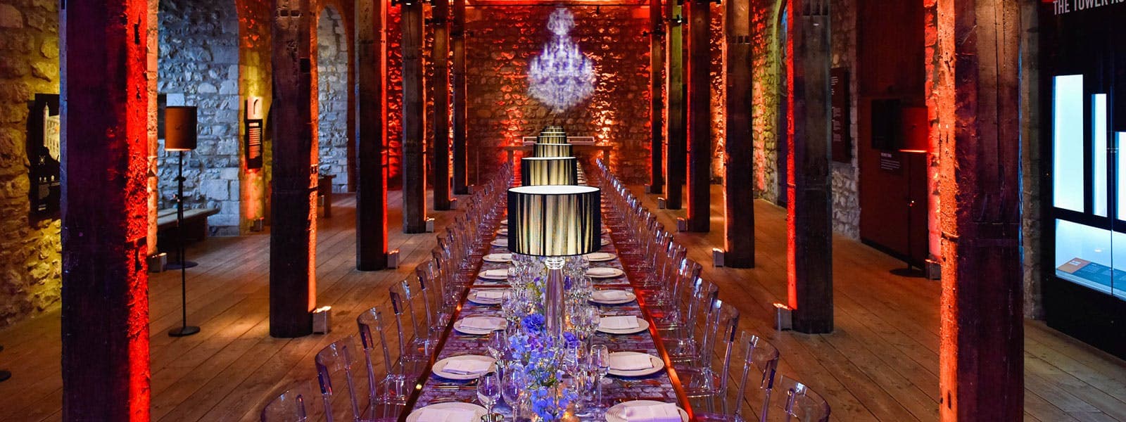 Industrial-chic Main Gallery gala dinner venue with dramatic lighting.