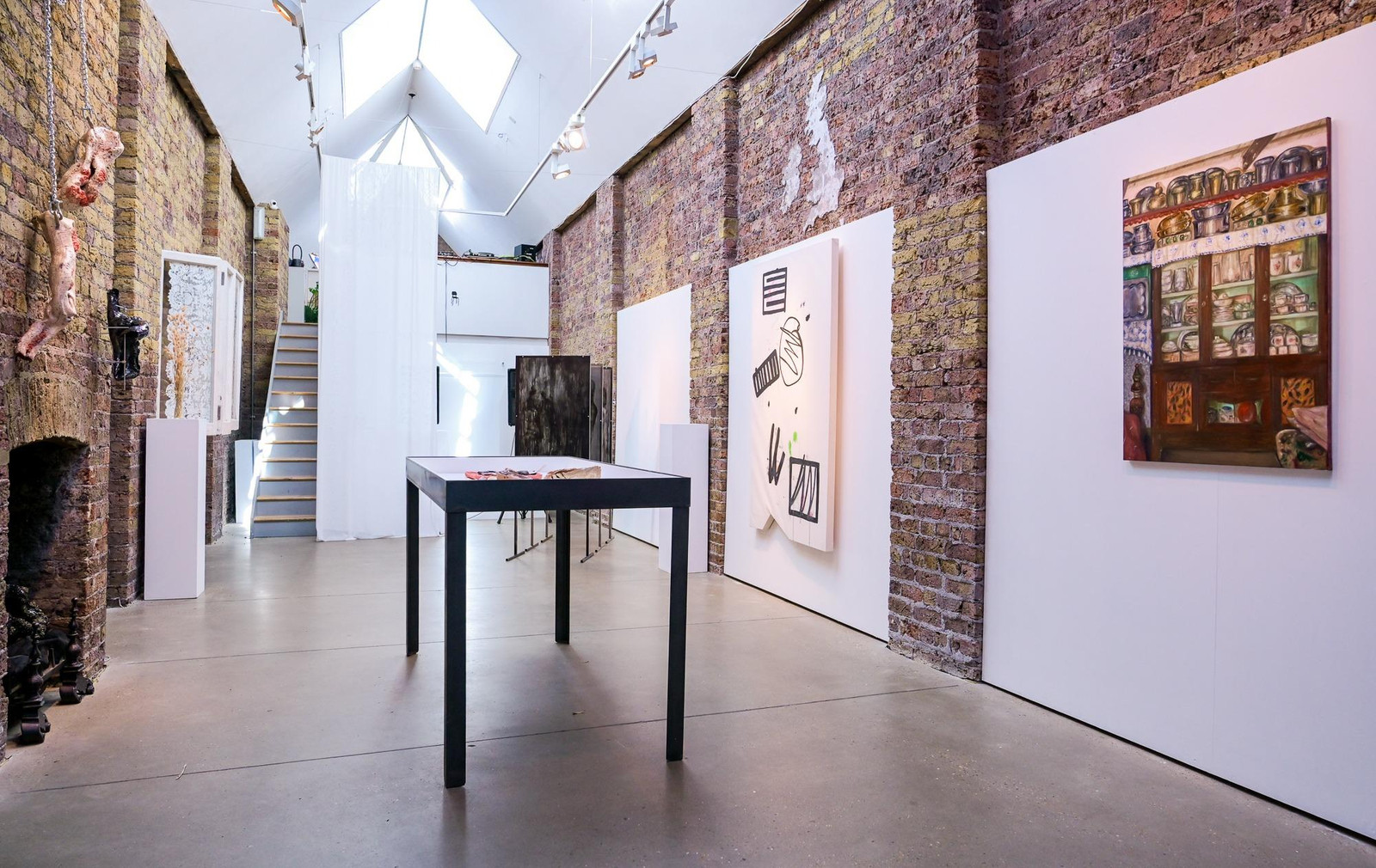Main Gallery: Exposed brick venue for intimate art openings and boutique product showcases.