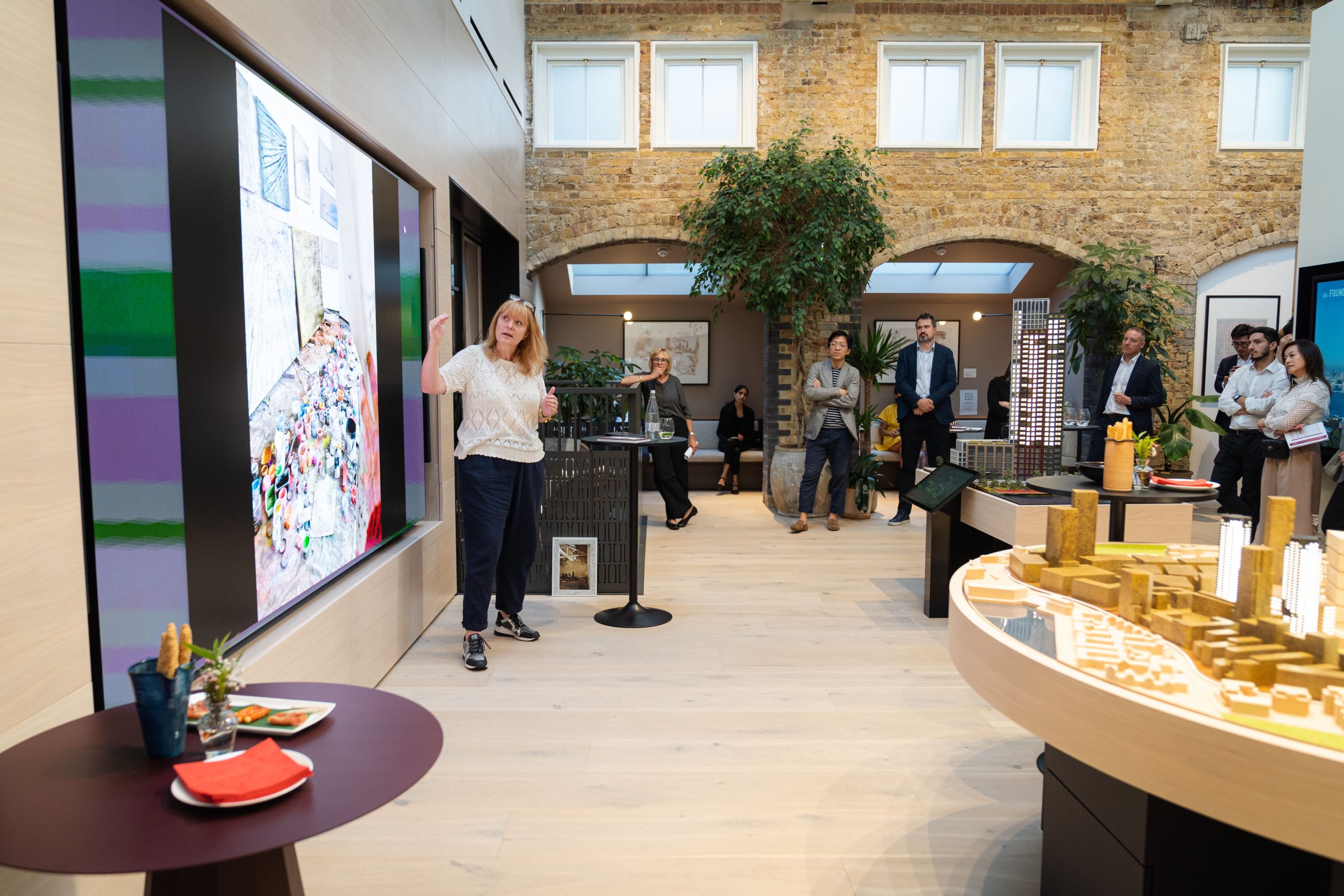 Main Gallery stakeholder briefing venue featuring AV display for brand activations and presentations.