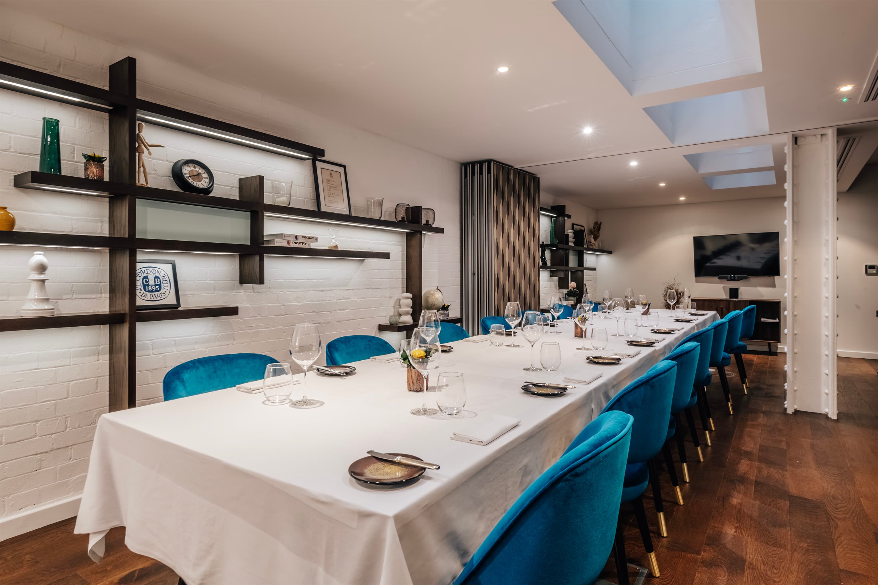 Private dining room at CORD by Le Cordon Bleu with velvet seating for corporate events or meetings.