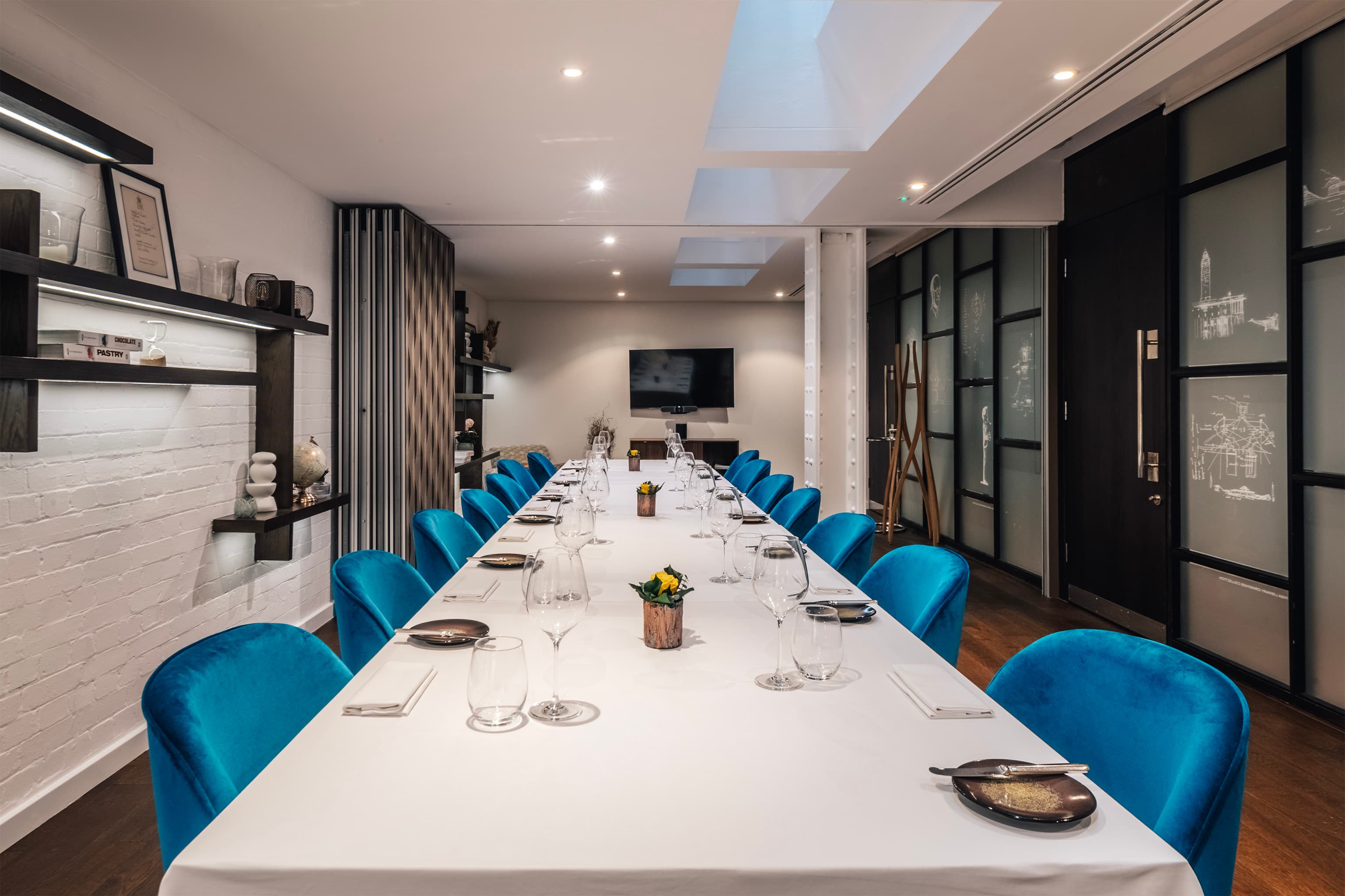 CORD Restaurant private dining room with blue velvet chairs for luxury corporate events.