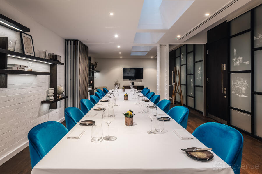 Teal velvet boardroom at Viceroy CORD Restaurant for private dining and corporate meetings.