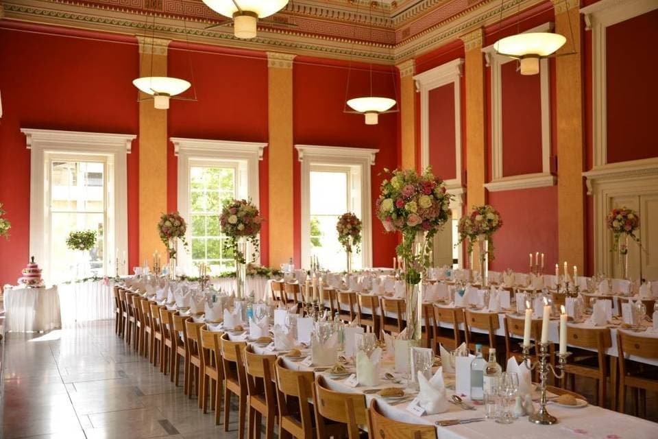 College Hall at Downing College: elegant red banquet hall for formal dinners and gala events.