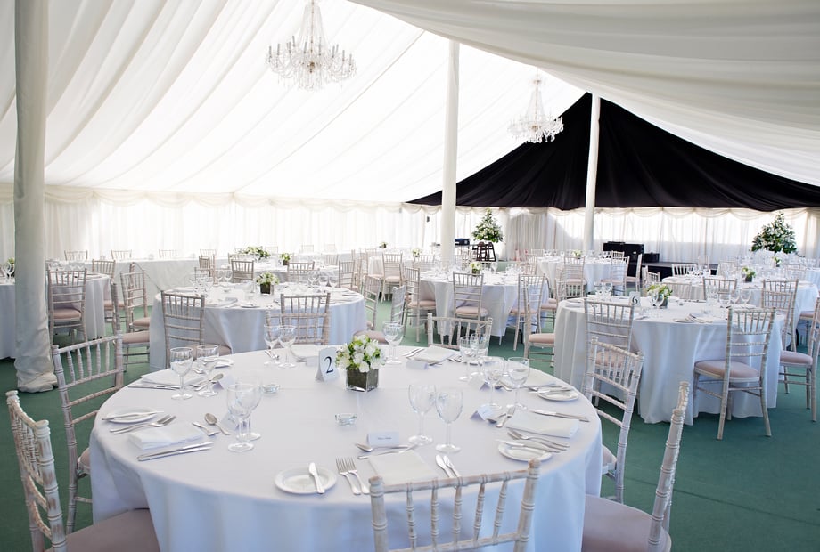 Elegant marquee wedding and corporate gala setup with chiavari chairs at Rectory Farm.