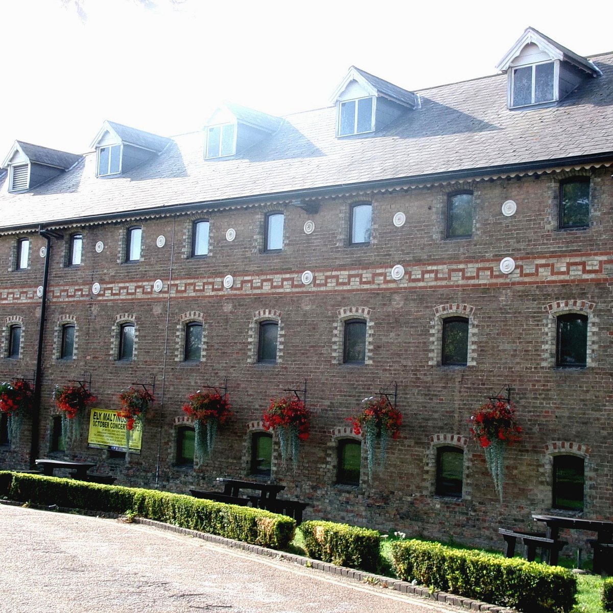 Historic Maltings venue for corporate retreats and rustic events with spacious brick exterior.