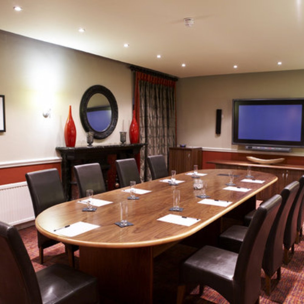 Terminal Suite boardroom with oval table for corporate meetings and strategy sessions.