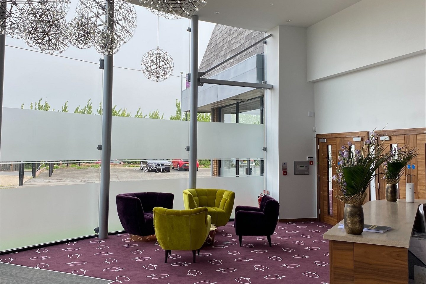 Beulah Suite modern foyer with natural light, perfect for intimate networking or event registration.