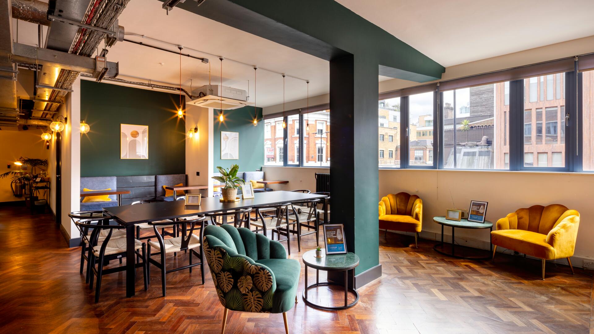 Saunders Room breakout space with boardroom and lounge seating for corporate meetings or workshops.