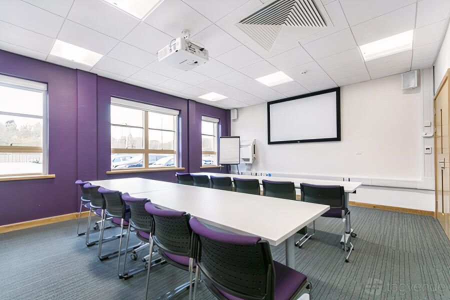 Twycross Room boardroom: LOROS Centre flexible space for corporate workshops and training sessions.