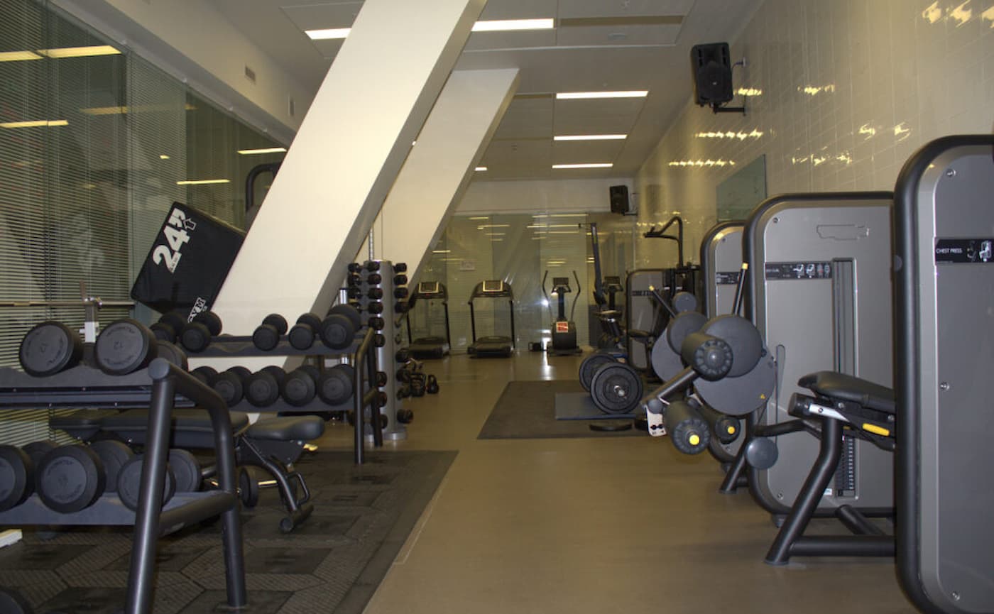 Holland Park School indoor sports hall, fitness center for corporate wellness and event venue.